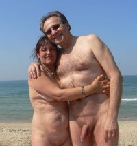 Lovely older couple on the beach showing guy's big semi-hard cock and and wife's saggy breasts and shaved cunt