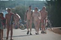 Middle-age couple at the nudist camp showing man's shaved cock and woman's flabby tits and shaved vagina