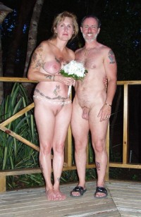 My nude wedding photo showing my wife's huge flabby tits and big trimmed cunt and my trimmed uncut small cock with hanging balls