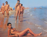 Nude dad taking picture of his nude girl with firm tits on the nude beach