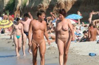 Nude woman with huge flabby breasts and shaved twat walking with some stranger with uncut small shaved penis