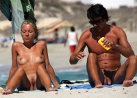 Nudist couple on the beach showing wife spreading her big trimmed cunt and husband with big cut dick