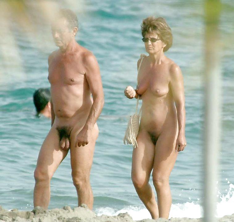 Old Hairy Nude Couple At The Walk On The Beach