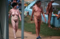 Older woman with big saggy tits and hairy pussy walking nude with her husband's small uncut hairy dick