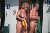 Older woman with huge nipples on her saggy tits and shaved cunt walking with her husband's tiny shaved cock