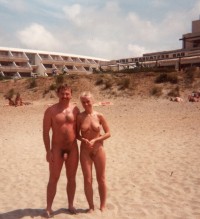 Our nude family photo from our last vacation showing my young wife's nice saggy tits and my small uncut hairy penis