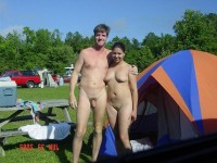Young nude couple showing girl's big shaved cunt and boy's hairy semi-hard dick