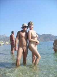 My mistress with huge flabby tits with big nipples and her shaved pussy looking at my semi-hard shaved penis with long foreskin