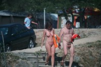 Older guy with huge balls and small uncut cock with long foreskin in a nudist camp with his younger mistress with flabby tits with large nipples and huge trimmed vagina