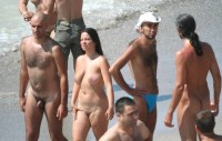 Walking nude on a beach with my tiny little hairy uncut cock and my girlfriend with big saggy tits and small shaved pussy